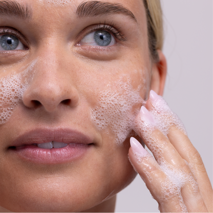 Woman applying Doctor Rogers Face Wash | Best natural gentle cleanser for dry, sensitive skin onto face to remove makeup, sunscreen and oil while hydrating and repairing skin barrier